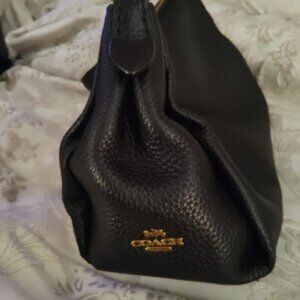 Coach hand bag black leather . In mint condition.